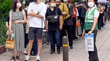 The Latest: Tokyo apologizes for vaccine rollout confusion