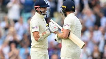 England v India: Ollie Pope and Chris Woakes star on hard-fought day