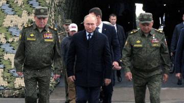 Putin watches huge display of firepower during Russian war games
