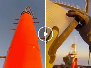 Changing a bulb on a 2000ft tower gets a HELL NO from me (Video)
