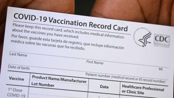 2 charged in separate vaccination card schemes