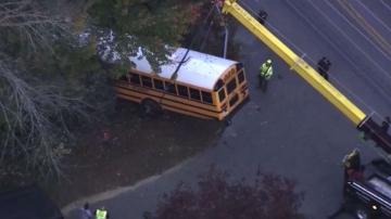 School bus carrying 6 children crashes into woods; all safe
