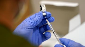 Businesses nervously await fine print of vax-or-test rule
