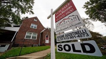 Existing home sales surge as interest rates point higher