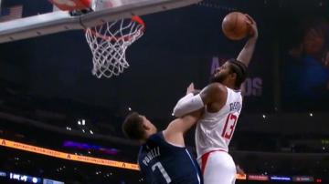 Clippers’ Paul George throws down a massive dunk over Powell