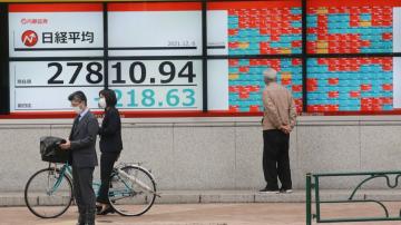 Asian shares mixed after China Evergrande warns of cash woes