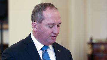 Australia's deputy leader tests positive for virus in the US