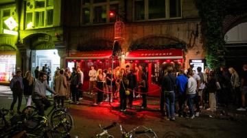 Denmark orders eateries to close early, bans large concerts