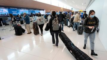 Flight cancellations drag on as airlines short-staffed