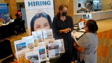 US unemployment sinks to 3.9% as many more people find jobs