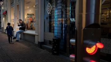 In southern Dutch town, cafes open in lockdown protest