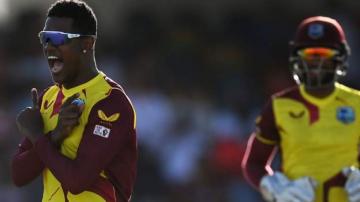 West Indies v England: Tourists bowled out for 103 to lose first T20 in Barbados