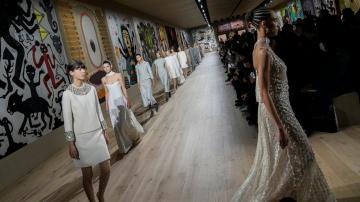 Dior celebrates couture craft, as maskless Delevingne irks