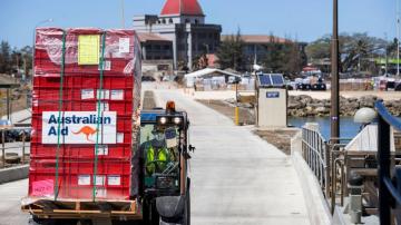 Virus enters Tonga along with disaster aid, lockdown planned