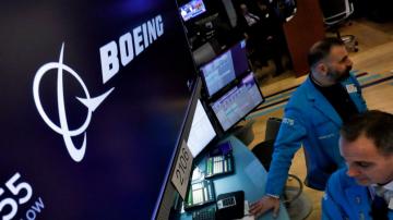 Boeing jet deliveries and orders rise from a year earlier