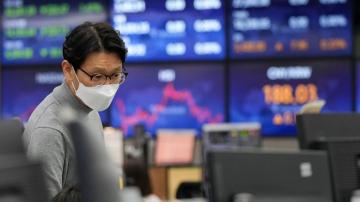 Asian shares skid as hot inflation data point to rate hikes