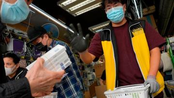 Hong Kong considers lockdown as daily infections top 34,000