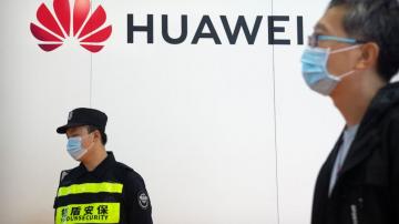 China's Huawei says 2021 sales down, profit up
