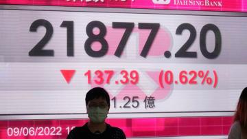Asian shares fall as oil lingers above $120, yen sinks
