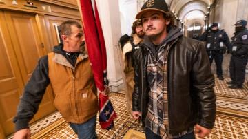 Man who carried Confederate flag into Capitol heads to trial
