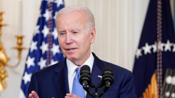 Biden says new shipping costs law may help tame inflation