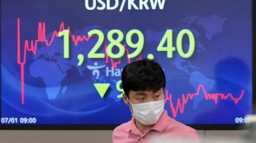 Asian shares mostly lower after pessimistic 'tankan' survey