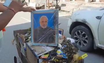 Video: Row Over UP Man Pushing Garbage Cart With PM, Yogi Adityanath Pics