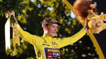 Tour de France: Jonas Vingegaard crowned champion as Jasper Philipsen wins in Paris