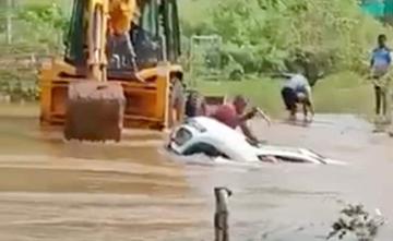 Windshield Smashed Just In Time, 2 Rescued From Car In Karnataka Flood