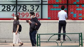 Global stocks gain as traders watch Fed speech