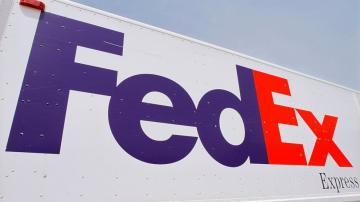 FedEx to close stores, put off hiring as demand slumps