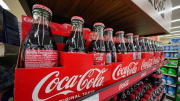 Coke raises sales outlook after higher prices boost Q3 sales