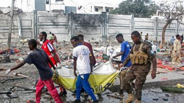 Two explosions rock Somalia's capital, leaving "scores" dead