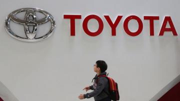 Toyota reports quarterly profit decline amid chips crunch