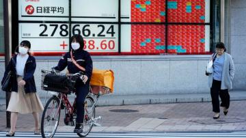 Asian markets mixed ahead of US elections, inflation data