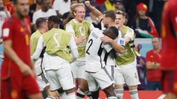 Germany score late for crucial draw against Spain