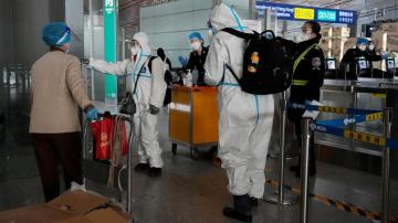 China reduces COVID-19 case number reporting as virus surges