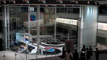 Asian shares higher in thin holiday trading