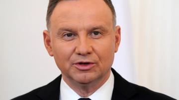 Polish leader asks court to vet bill that's key for EU aid