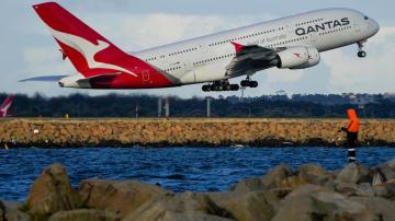 Qantas back in black with $978 million half-year profit