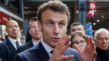 Macron defends contested pension plan at French farm fair
