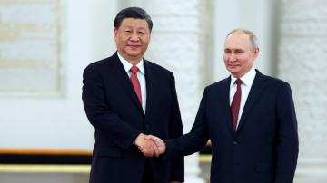 Putin hosts Xi in the Kremlin with imperial palace pageantry
