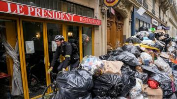 French protests drag on after Macron's pension plan push