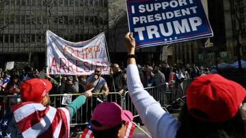 Small group of Trump supporters, foes face off over criminal case
