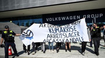 Topless protester briefly disrupts VW annual meeting
