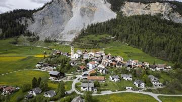 Stragglers pack up as Swiss village is evacuated under rockslide threat