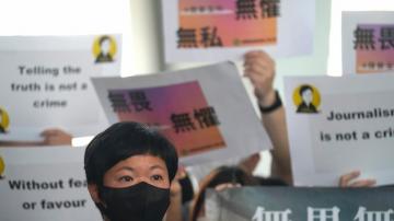 Award-winning Hong Kong journalist wins appeal in rare court ruling upholding media freedom