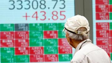 Stock market today: Asian shares sink as central banks crank interest rates still higher