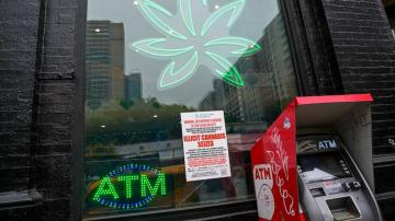 New York cracks down on unlicensed pot shops, but closing them might take time