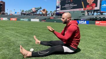 Baseball players are staying mindful on the diamond with barefoot walks in the grass